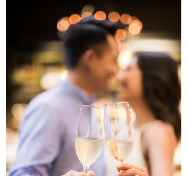 Engagement Party - Couple Holding Champagne Glasses