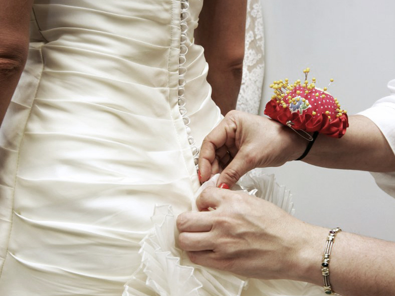 Wedding Dress Shopping - Back Of Wedding Dress Being Altered