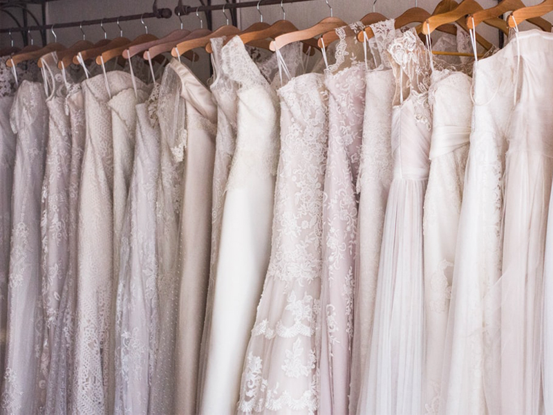 Wedding Dress Shopping - Wedding Dresses Hanging Up On Rack